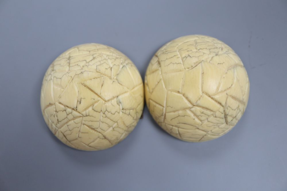 A 19th century Dieppe ivory noix ball diptych, the interior carved with hunting scenes, 5.5 diameter